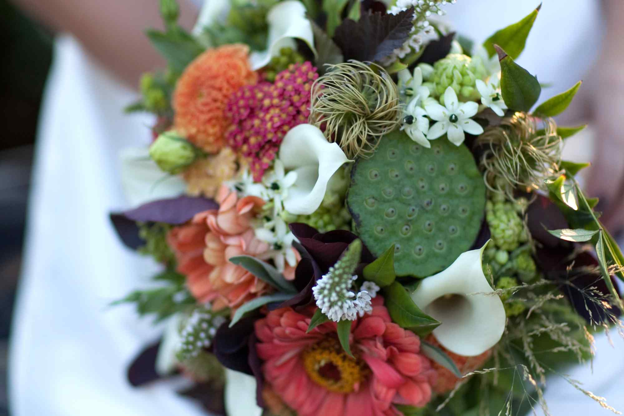 bridal bouquet for fall wedding including orange wine dahlias